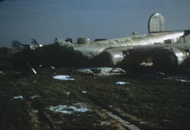 A B-24 Liberator (WQ-V, serial number 42-50427) nicknamed "Puritanical Witch" of the 44th Bomb Group that crashed on take off at Shipdham 22 March 1945. Written on slide casing: '250427 WQV Puritanical Itch, T/O Cr 22/3/45.'