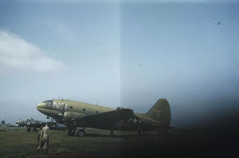 A C-46 Commando (N3-A, serial number 44-77541) of the 313rd Troop Carrier Group with a B-17 Flying Fortress. US Air Force Photo. Written on slide casing: 'Thurliegh.'